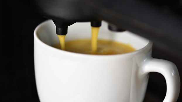 Coffee machine making espresso coffee. Morning cup of coffee for a good start of the day
