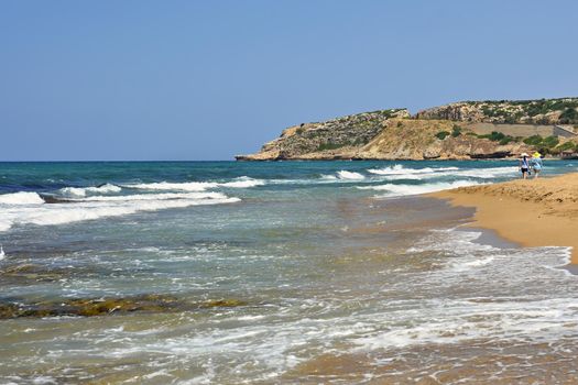 Beautiful clean sea and waves. Summer background for travel and holidays. Greece Crete.. Amazing scenery on the beach. 