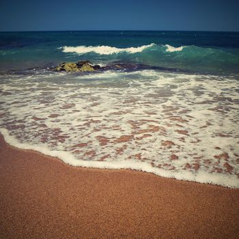 Beautiful clean sea and waves. Summer background for travel and holidays. Greece Crete.. Amazing scenery on the beach. 