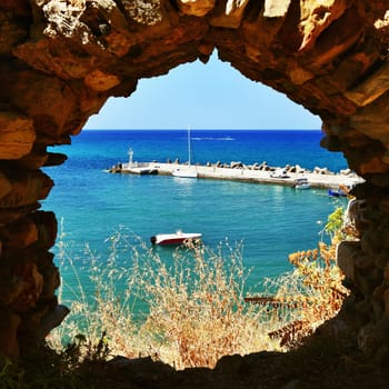 Traditional beautiful Greek village of Panormos on the island of Crete. Summer background for travel and holidays.