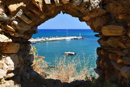 Traditional beautiful Greek village of Panormos on the island of Crete. Summer background for travel and holidays.