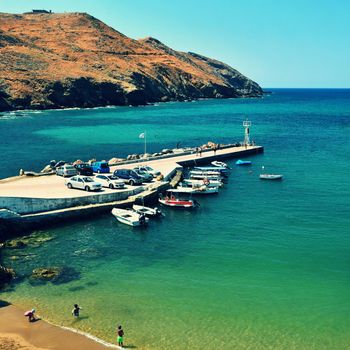 Traditional beautiful Greek village of Panormos on the island of Crete. Summer background for travel and holidays.