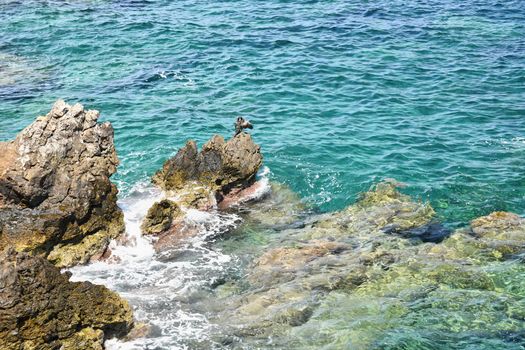 Beautiful clean sea and waves. Summer background for travel and holidays. Greece Crete.. Amazing scenery on the beach. 