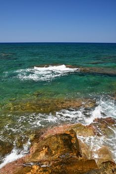 Beautiful clean sea and waves. Summer background for travel and holidays. Greece Crete.. Amazing scenery on the beach. 