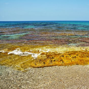 Beautiful clean sea and waves. Summer background for travel and holidays. Greece Crete.. Amazing scenery on the beach. 