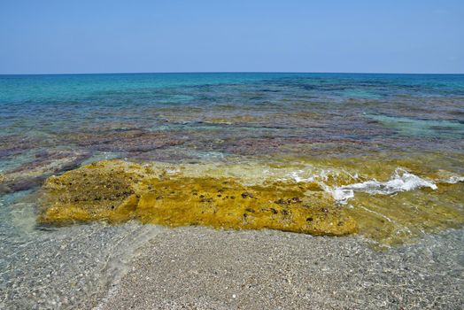 Beautiful clean sea and waves. Summer background for travel and holidays. Greece Crete.. Amazing scenery on the beach. 