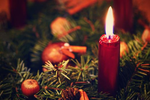 Colorful christmas Decoration. Winter holidays and traditional ornaments on a Christmas tree. Lighting chains - candles for seasonal background.