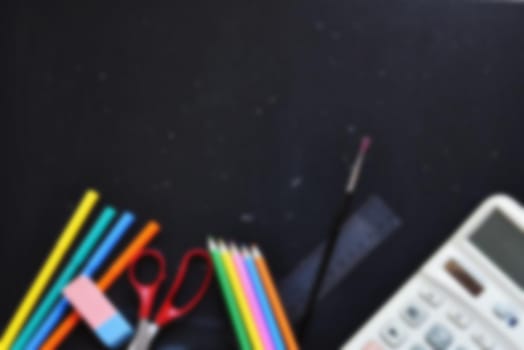 Background back to school. Blackboard with school aids.