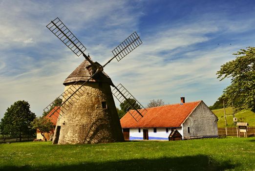 Old windmill - Czech Republic Europe. Beautiful old traditional mill house with a garden. Kuzelov - South Moravia.