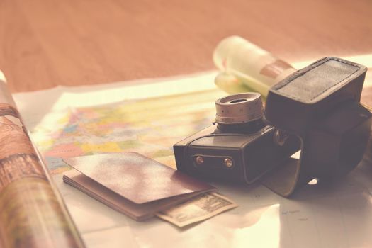 Beautiful concept for summer travel. Map with sunset and accessories for vacation planning.