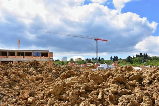 Crane and construction of new buildings. Beautiful background for the construction industry. 