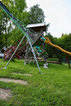 Swings playground.
A place for children to play outdoors.Nature - game.