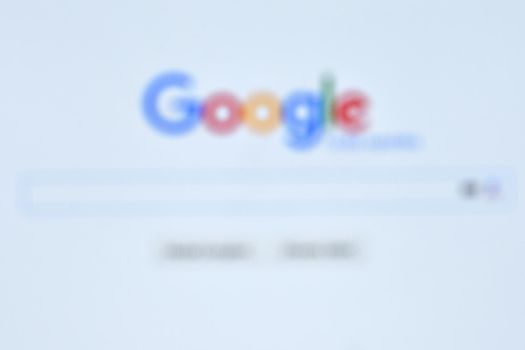 The largest Internet search engine. Blurred background with the word Google.
