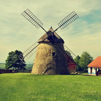 Old windmill - Czech Republic Europe. Beautiful old traditional mill house with a garden. Kuzelov - South Moravia.