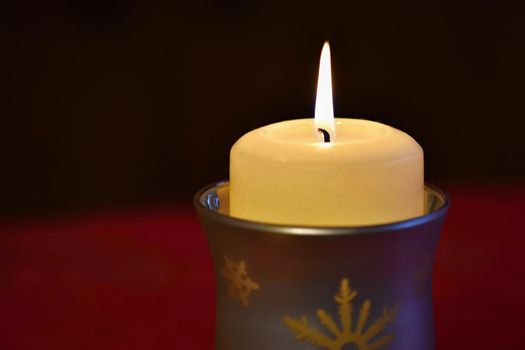 beautiful candle burning with a pure black background