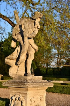 Beautiful sculpture in the park at sunset.
Slavkov castle garden. Czech Republic Europe.