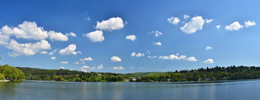 Pond with forest and blue sky with clouds. Brno Dam recreation spot Czech Republic. Czech Republic, City of Brno - Bystrc - Kninicky.