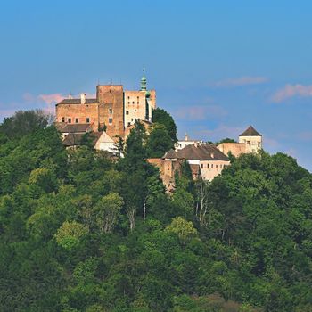 Beautiful old castle Buchlov. South Moravia-Czech Republic-Europe.
Spring landscape with forests, castle and blue sky.