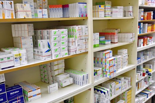 Medical Pills And Supplements On Pharmacy Stand.