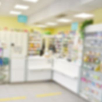 Pharmacy blurred background. Pharmacy store drugs shelves interior blurred background