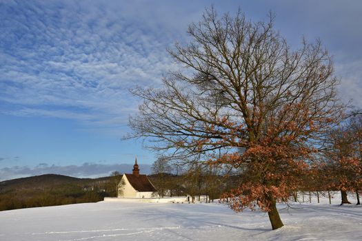 Winter landscape with a beautiful chapel near castle Veveri. Czech Republic city of Brno. The Chapel of the Mother of God.