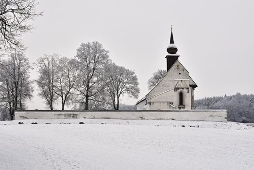Winter landscape with a beautiful chapel near castle Veveri. Czech Republic city of Brno. The Chapel of the Mother of God.