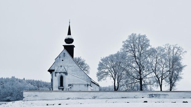 Winter landscape with a beautiful chapel near castle Veveri. Czech Republic city of Brno. The Chapel of the Mother of God.