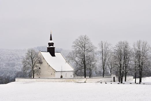 Winter landscape with a beautiful chapel near castle Veveri. Czech Republic city of Brno. The Chapel of the Mother of God.