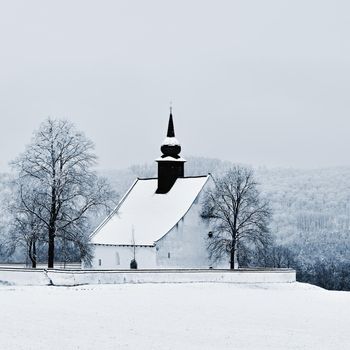 Winter landscape with a beautiful chapel near castle Veveri. Czech Republic city of Brno. The Chapel of the Mother of God.