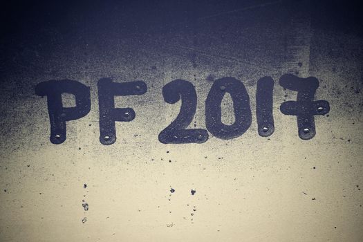 PF 2017 written on a misty window. Background for the celebration of the New Year 2017