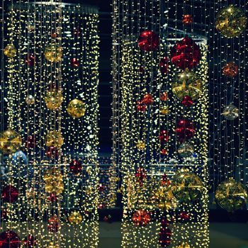 Colorful christmas Decoration. Winter holidays and traditional ornaments. Lighting chains-bulbs for seasonal background.