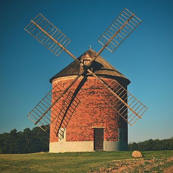 Beautiful old windmill and landscape with the sun. Chvalkovice - Czech Republic. Europe.