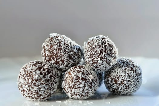Homemade coconut rum balls on plate. Christmas sweets. Traditional homemade handmade Czech sweets.