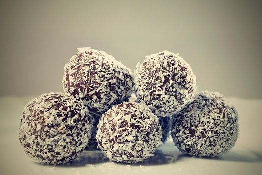 Homemade coconut rum balls on plate. Christmas sweets. Traditional homemade handmade Czech sweets.