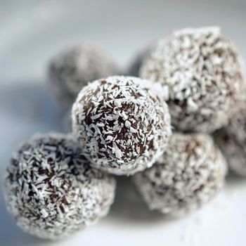 Homemade coconut rum balls on plate. Christmas sweets. Traditional homemade handmade Czech sweets.