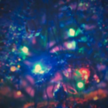 Blurred xmas background, christmas texture and background from color lights.