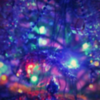 Blurred xmas background, christmas texture and background from color lights.