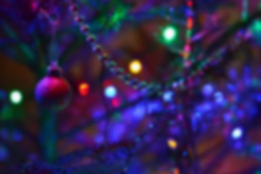 Blurred xmas background, christmas texture and background from color lights.