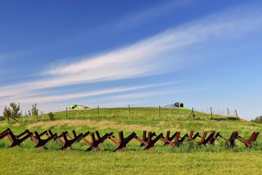 Watchtower and line of defense, old state border of the Iron Curtain - barbed fence. Memorial military area - Satov Czech Republic.