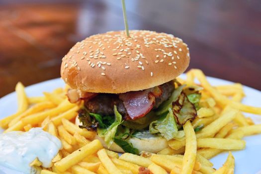 Hamburger with fries. 