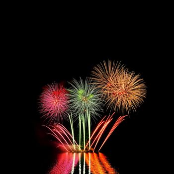 Beautiful colorful fireworks with reflections in water. Brno dam, the city of Brno-Europe. International Fireworks Competition.