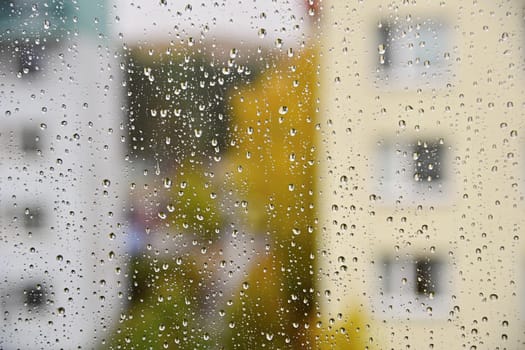 Rain. Autumn seasonal background with rain drops on the window.