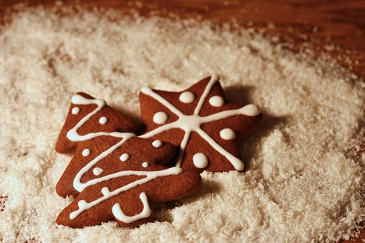 Christmas tree and snowflake. Beautiful sweet Christmas candy. Hand-decorated, homemade gingerbread.