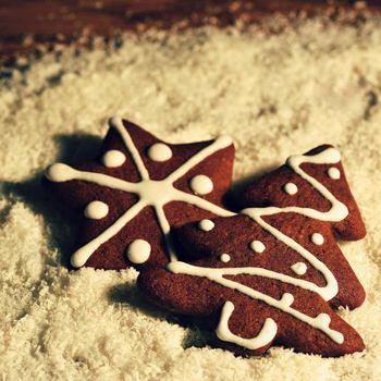 Christmas tree and snowflake. Beautiful sweet Christmas candy. Hand-decorated, homemade gingerbread.