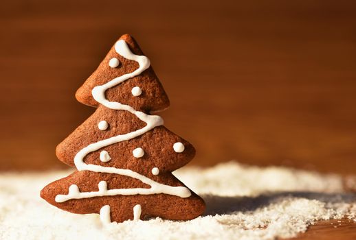 Christmas tree and snowflake. Beautiful sweet Christmas candy. Hand-decorated, homemade gingerbread.