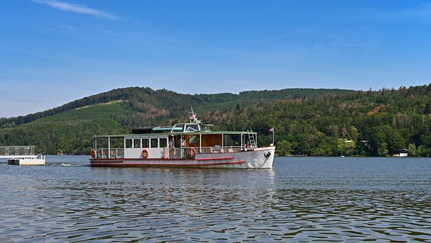 Cruise ship / steamer on the Brno dam. Beautiful summer sunny during recreation - vacation near water