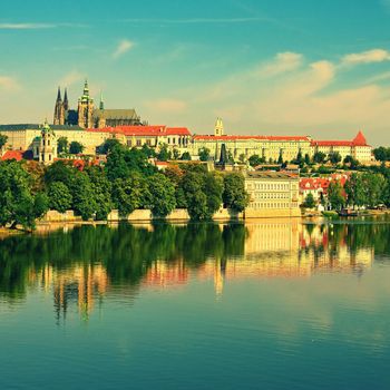 Prague, capital of the Czech Republic. Scenic sunset view of the Old Town pier architecture and Charles Bridge over Vltava river. 