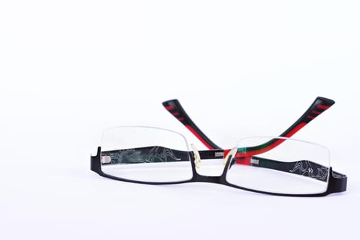 Red - black dioptric glasses isolated on a clean white background.