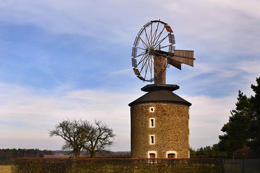 Beautiful old windmill at sunset with sky and clouds. Ruprechtov - Czech Republic - Europe.