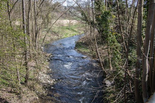 wild river in spring with spray